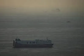Oil tankers transit through the Strait of Hormuz under heightened security amid rising geopolitical tensions.