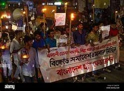 A large group of Chhatra League activists marching through the streets of Savar, carrying banners and chanting slogans against load shedding and fuel price hikes.