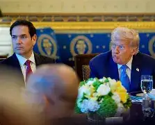 US Secretary of State Marco Rubio and President Donald Trump descending the stairs of Air Force One upon arrival in Beijing.