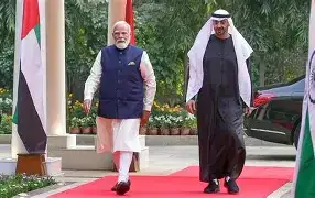 Prime Minister Narendra Modi and UAE President Mohamed bin Zayed Al Nahyan shaking hands warmly inside the presidential palace in Abu Dhabi.