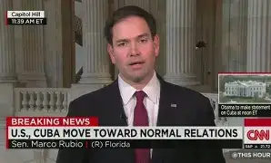 US Secretary of State Marco Rubio addressing reporters at a press podium inside the White House, speaking on Latin American foreign policy.