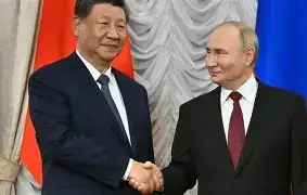 Chinese President Xi Jinping and Russian President Vladimir Putin walking together during an official diplomatic summit near Tiananmen Square in Beijing.
