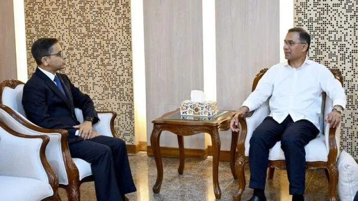 Outgoing Indian High Commissioner Pranay Verma shaking hands with Bangladesh Prime Minister Tarique Rahman during a formal farewell meeting in Dhaka.