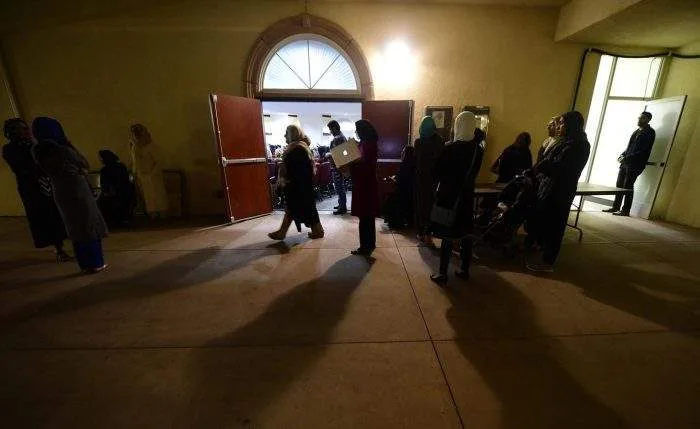San Diego police vehicles and emergency responders cordoning off the entrance of a large Islamic center near the US-Mexico border.