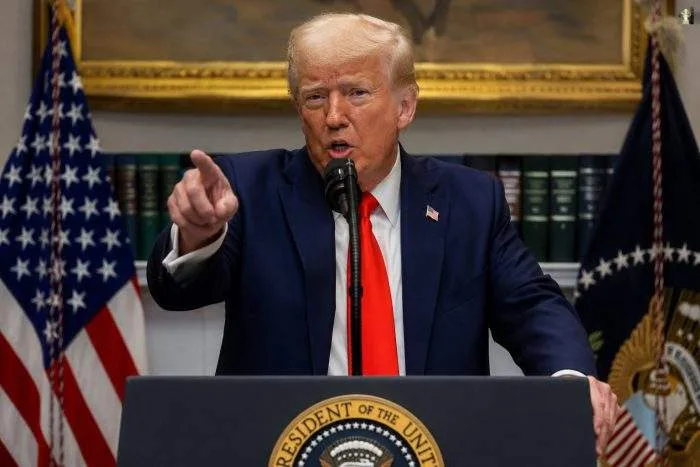 Horizontal close-up photo of US President Donald Trump during a recent white house press briefing.