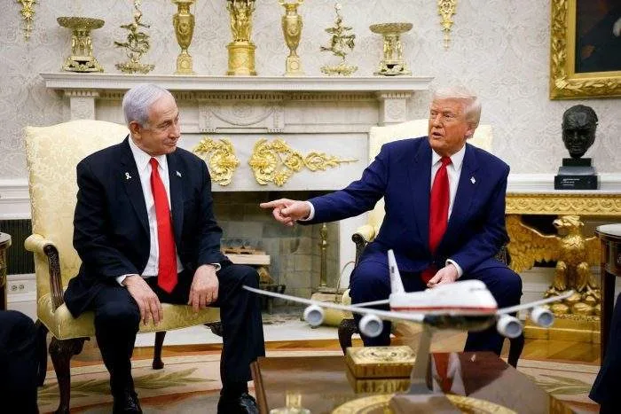 Horizontal view of President Donald Trump speaking during a press briefing regarding Middle East diplomacy.