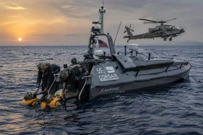Horizontal view of an autonomous unmanned surface vessel navigating through regional waters near Oman.
