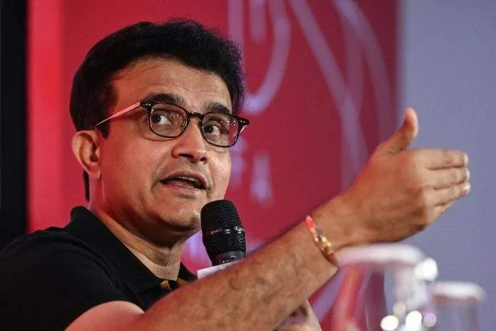 Former Indian cricket captain Sourav Ganguly speaking firmly into a microphone at a press conference in Kolkata.