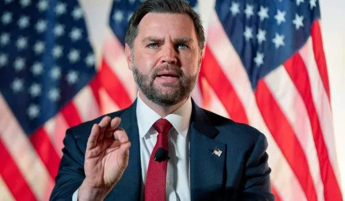 Horizontal close-up photo of US Vice President JD Vance speaking during a televised interview.