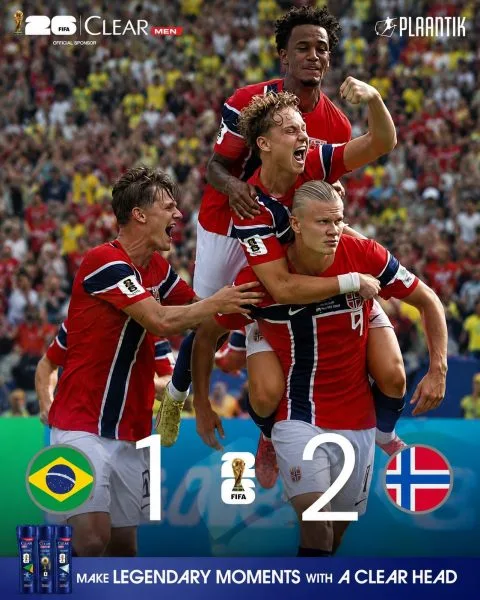A horizontal, wide-angle sports graphic featuring the scoreboard reading Brazil 1, Norway 2, set against a blurred background of a massive modern football stadium packed with cheering supporters under bright daylight.