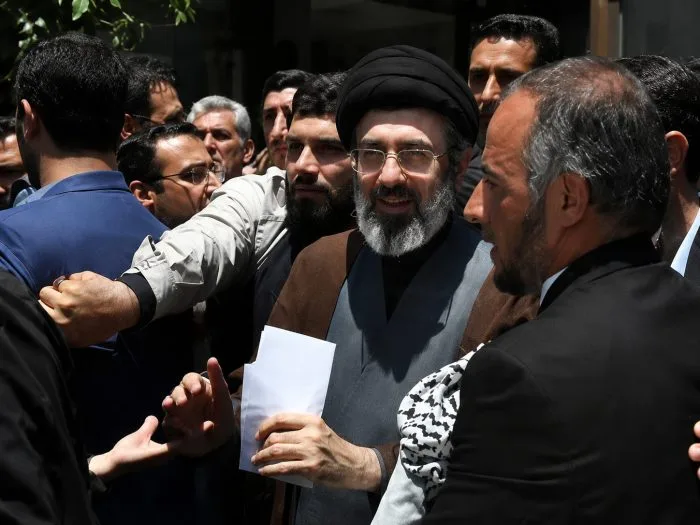 A horizontal, wide-angle cinematic visual showing a highly secured ceremonial space at a grand religious site under heavy security, highlighting defensive guard cordons and dynamic lighting to symbolize strategic protective lockdowns.