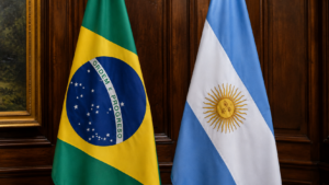 Horizontal shot showing the Brazilian and Argentine national flags displayed side by side at a diplomatic venue.