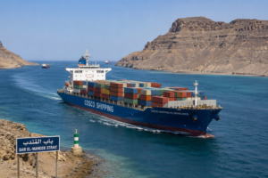 Commercial cargo vessel navigating through the strategic Bab el-Mandeb Strait near the Red Sea